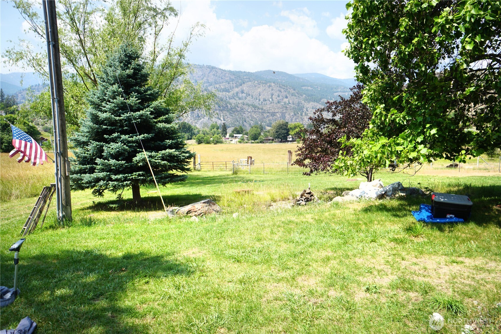 1112 Loomis-Oroville Road Loomis, WA 98827 - Photo 22 of 40 a view of a garden with a bench