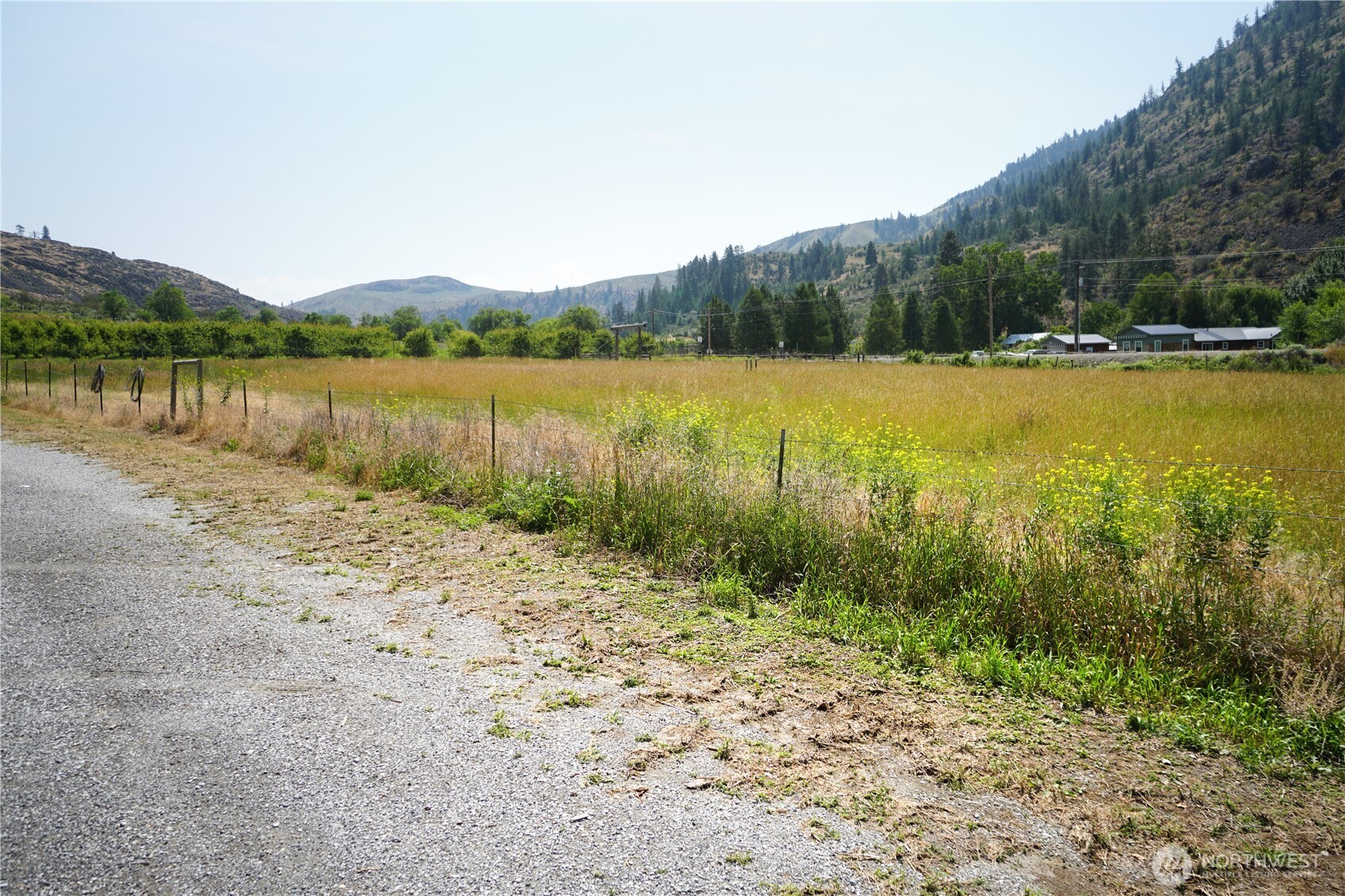 1112 Loomis-Oroville Road Loomis, WA 98827 - Photo 25 of 40 a view of a lake with houses in the back