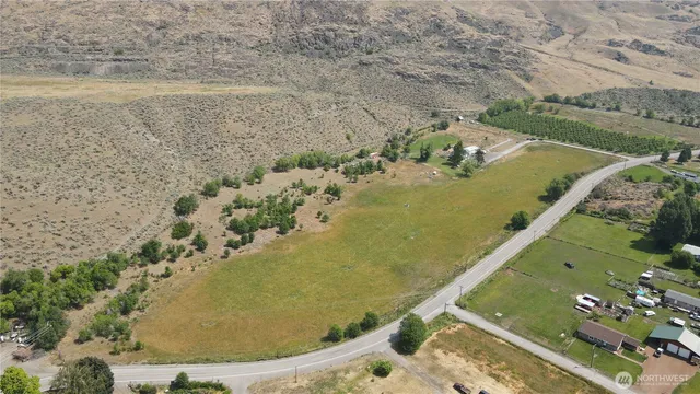 an aerial view of a house with a ocean view
