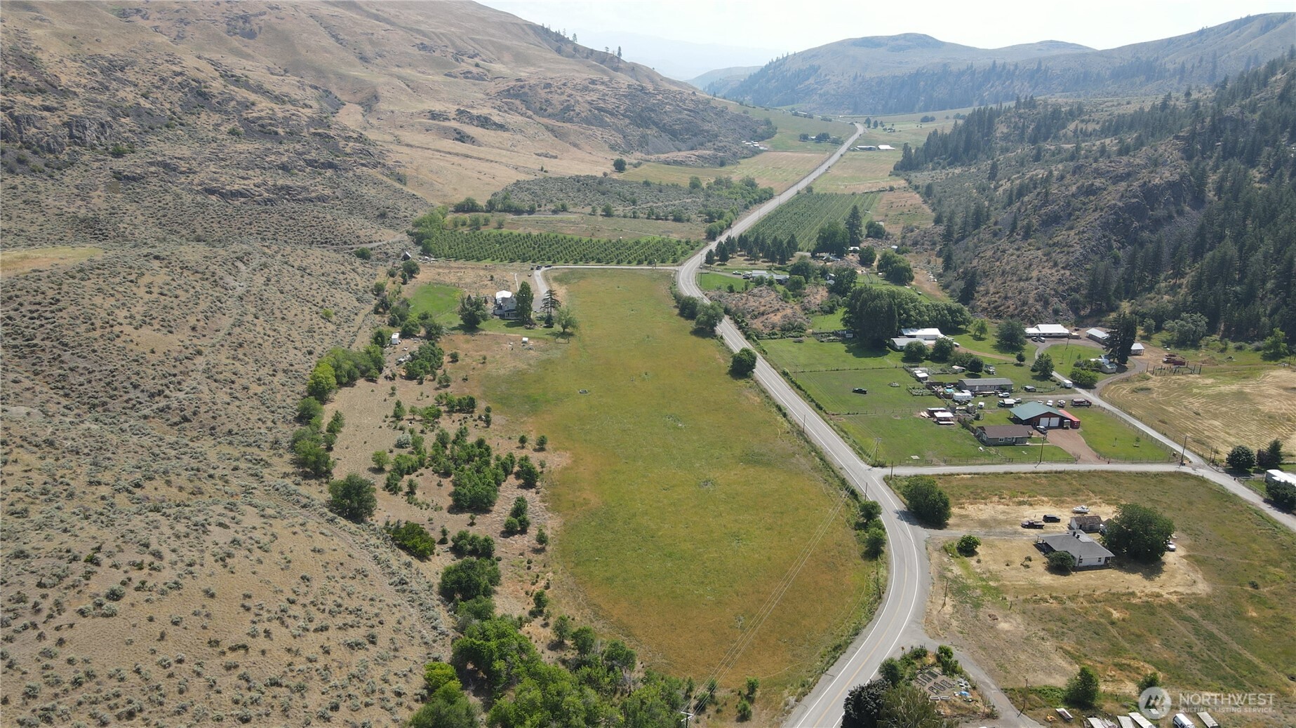 1112 Loomis-Oroville Road Loomis, WA 98827 - Photo 28 of 40 a view of a swimming pool with a yard