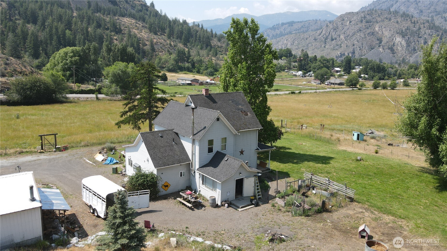 1112 Loomis-Oroville Road Loomis, WA 98827 - Photo 29 of 40 an aerial view of a house with garden space and ocean view