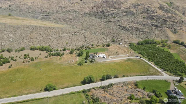 an aerial view of a house with a ocean view