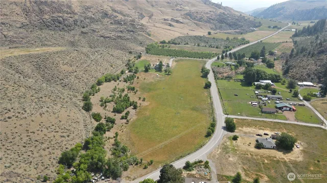 an aerial view of a house with outdoor space