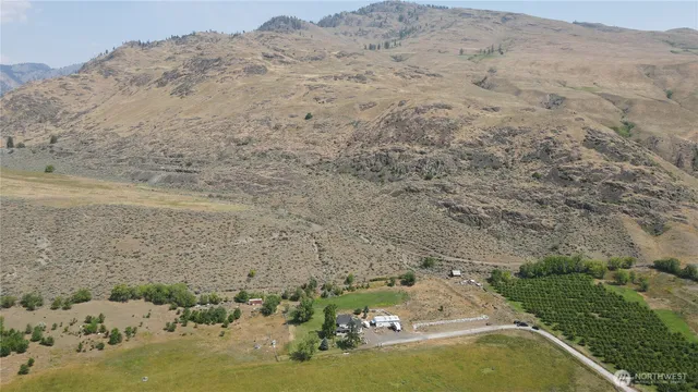 an aerial view of a residential houses with outdoor space
