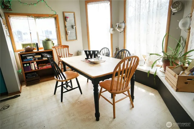a view of a dining room with furniture window and outside view