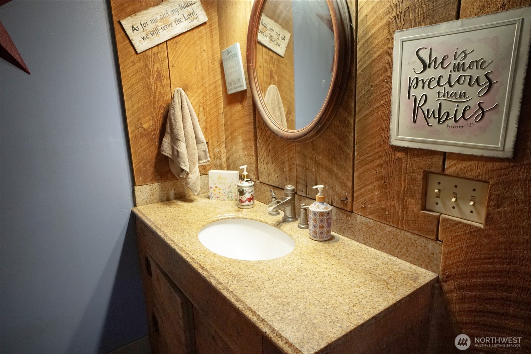 1112 Loomis-Oroville Road Loomis, WA 98827 - Photo 10 of 40 a bathroom with a granite countertop sink and a mirror