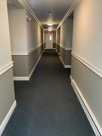 a view of a hallway with stairs