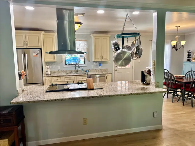 a kitchen with stainless steel appliances granite countertop a sink and a granite counter tops