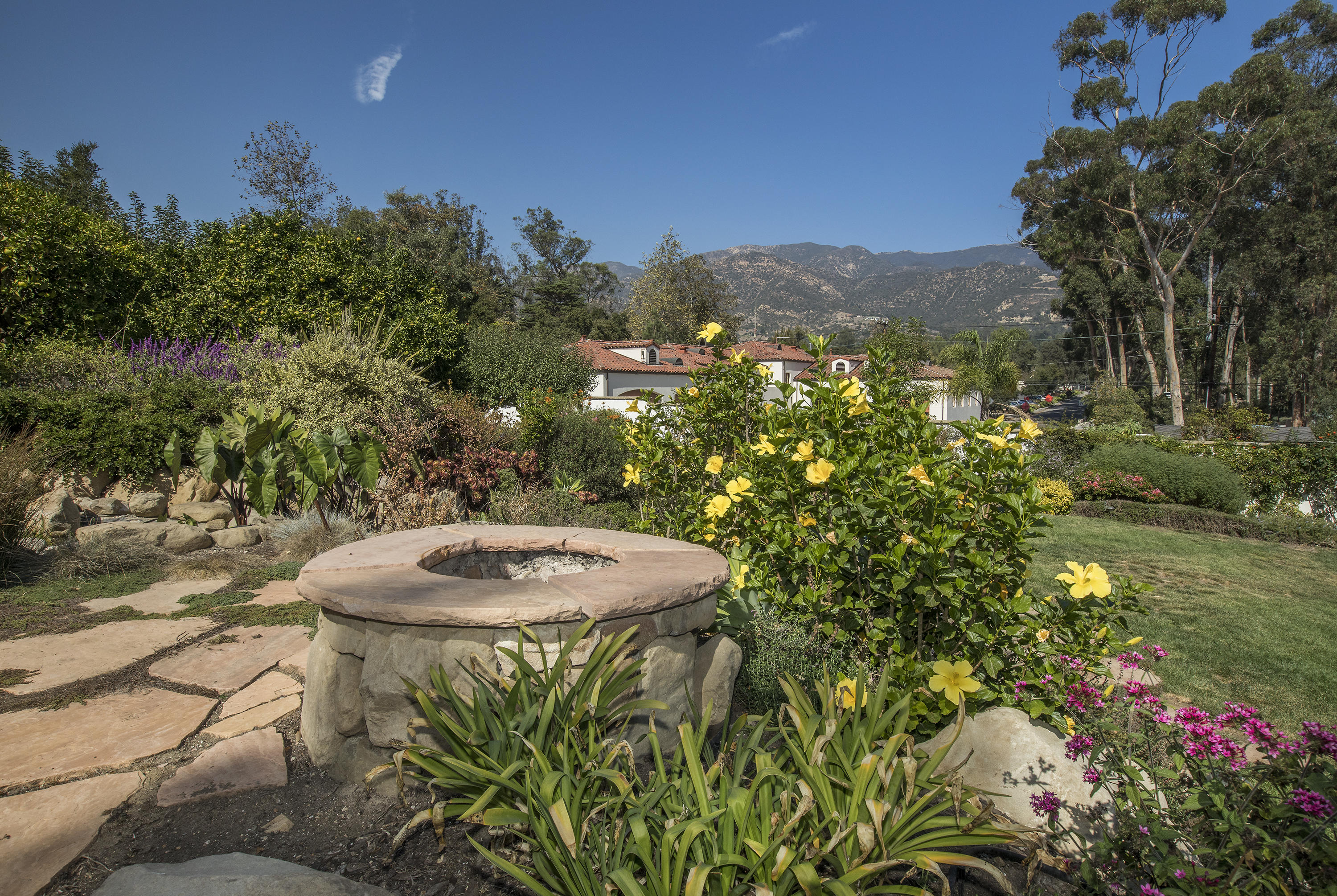 3165 Eucalyptus Hill Road Santa Barbara, CA 93108 - Photo 17 of 21 a backyard of a house with table and chairs