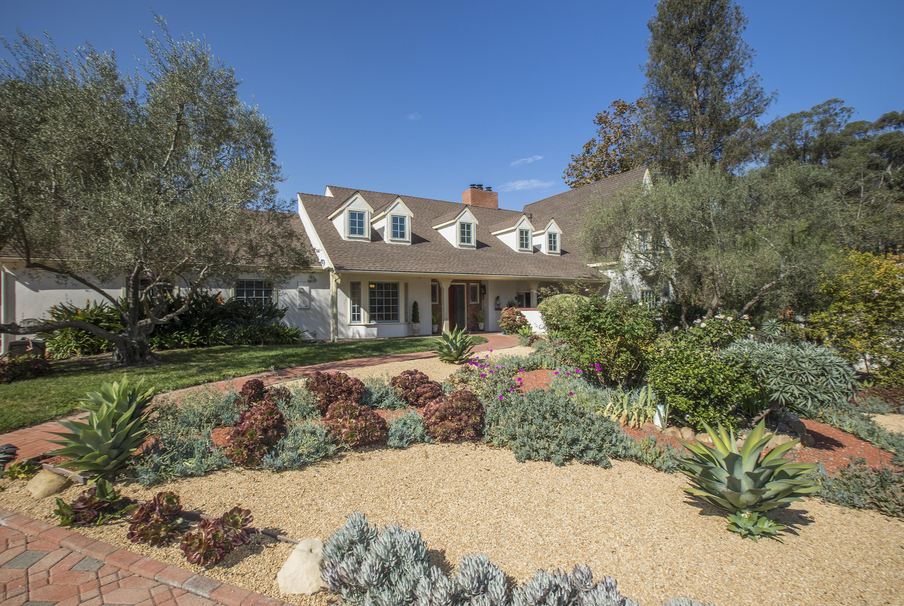 3165 Eucalyptus Hill Road Santa Barbara, CA 93108 - Photo 2 of 21 a front view of a house with a yard