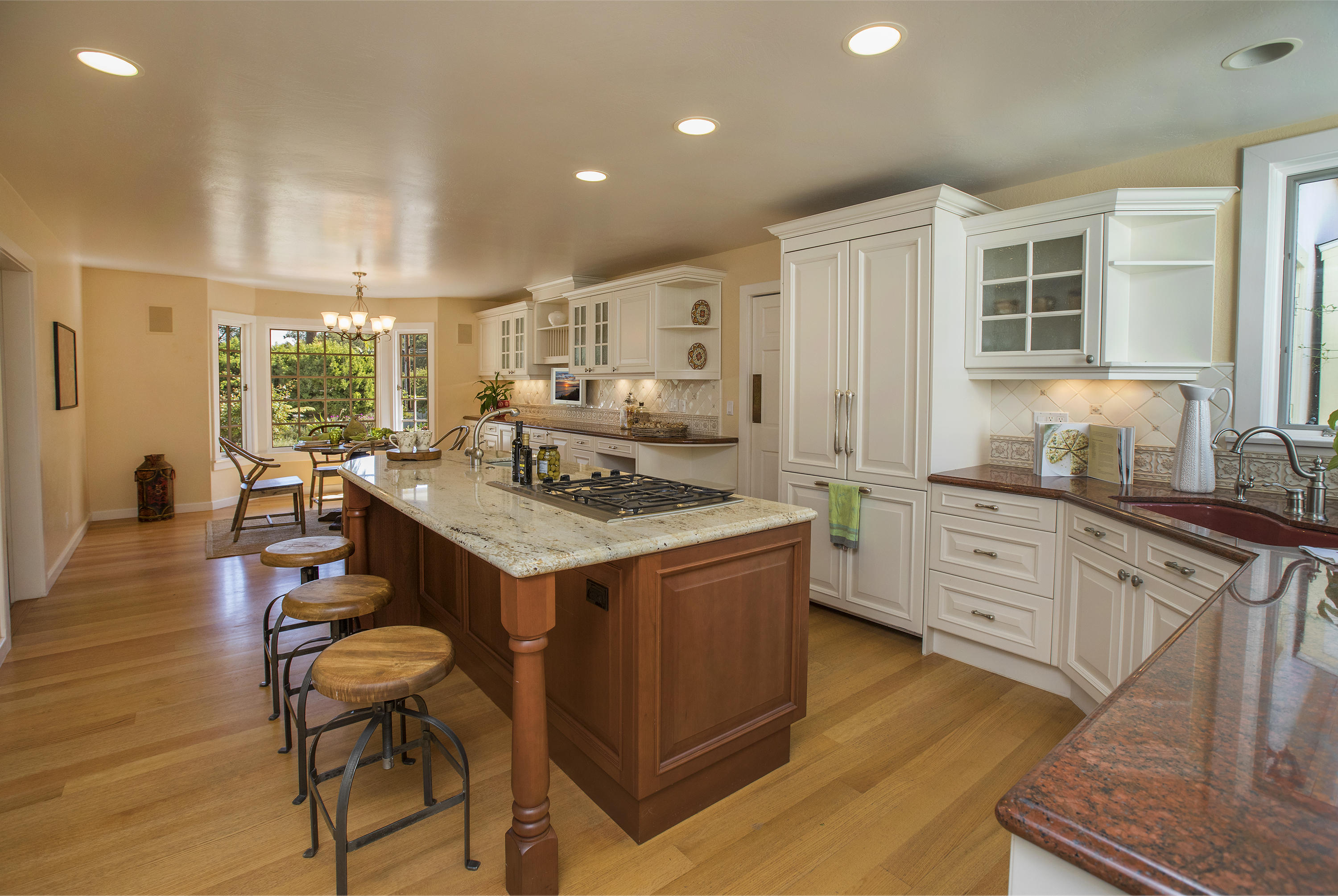3165 Eucalyptus Hill Road Santa Barbara, CA 93108 - Photo 7 of 21 a kitchen with a sink stove and wooden cabinets