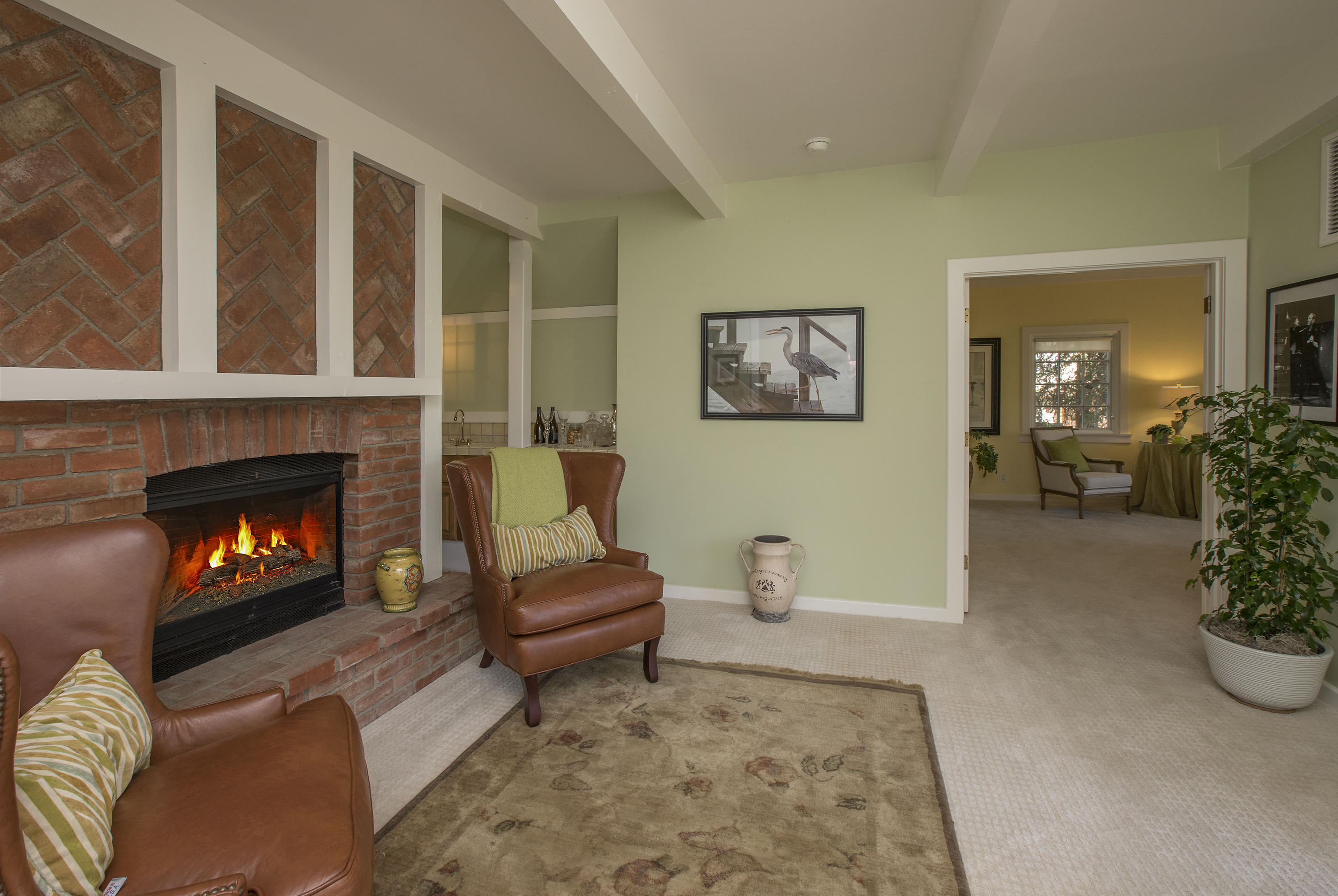 3165 Eucalyptus Hill Road Santa Barbara, CA 93108 - Photo 9 of 21 a living room with furniture and a fireplace