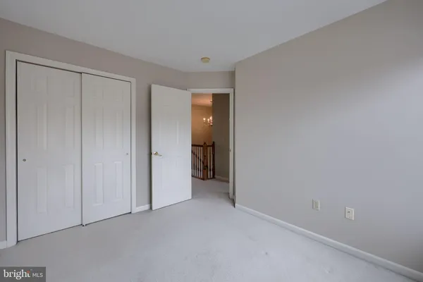 a view of an empty room and closet