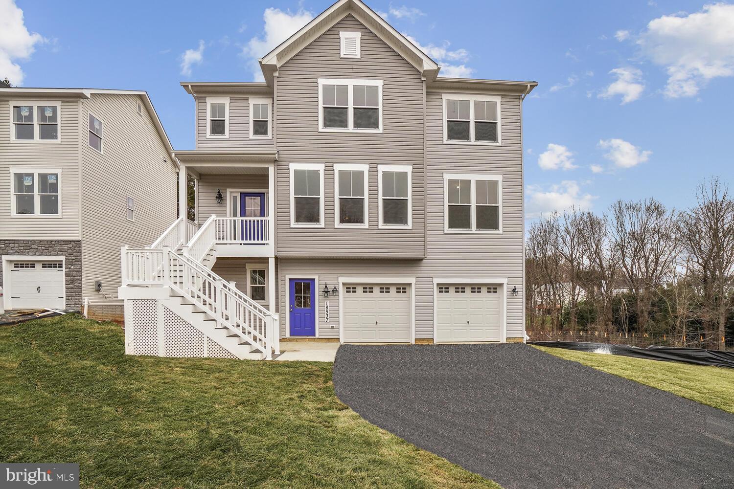 26022 Frederick Road Clarksburg, MD 20871 - Photo 1 of 26 a front view of a house with a yard