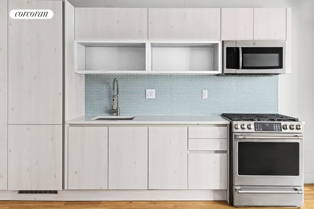 a view of a patio with table and chairs and garden