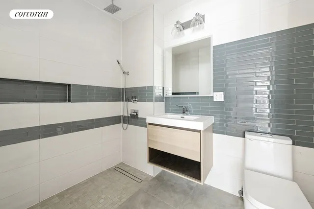 a kitchen with stainless steel appliances a stove and a microwave