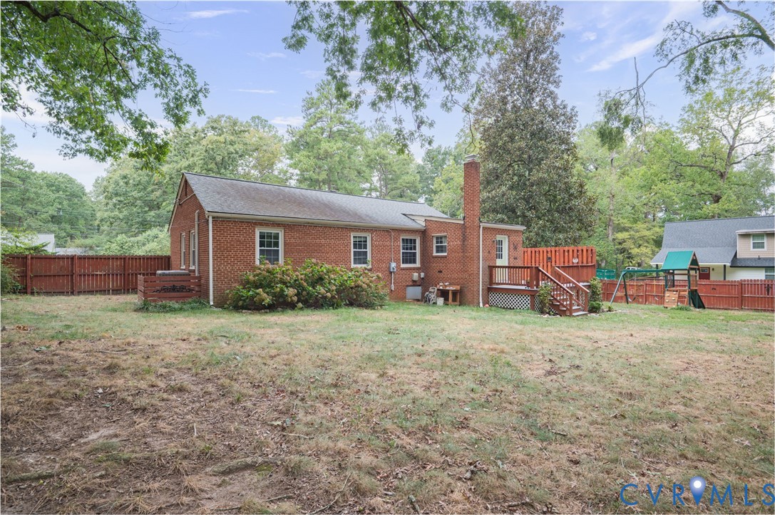 3353 Warner Road Richmond, VA 23225 - Photo 13 of 26 Brick exterior with a prominent chimney, wood deck