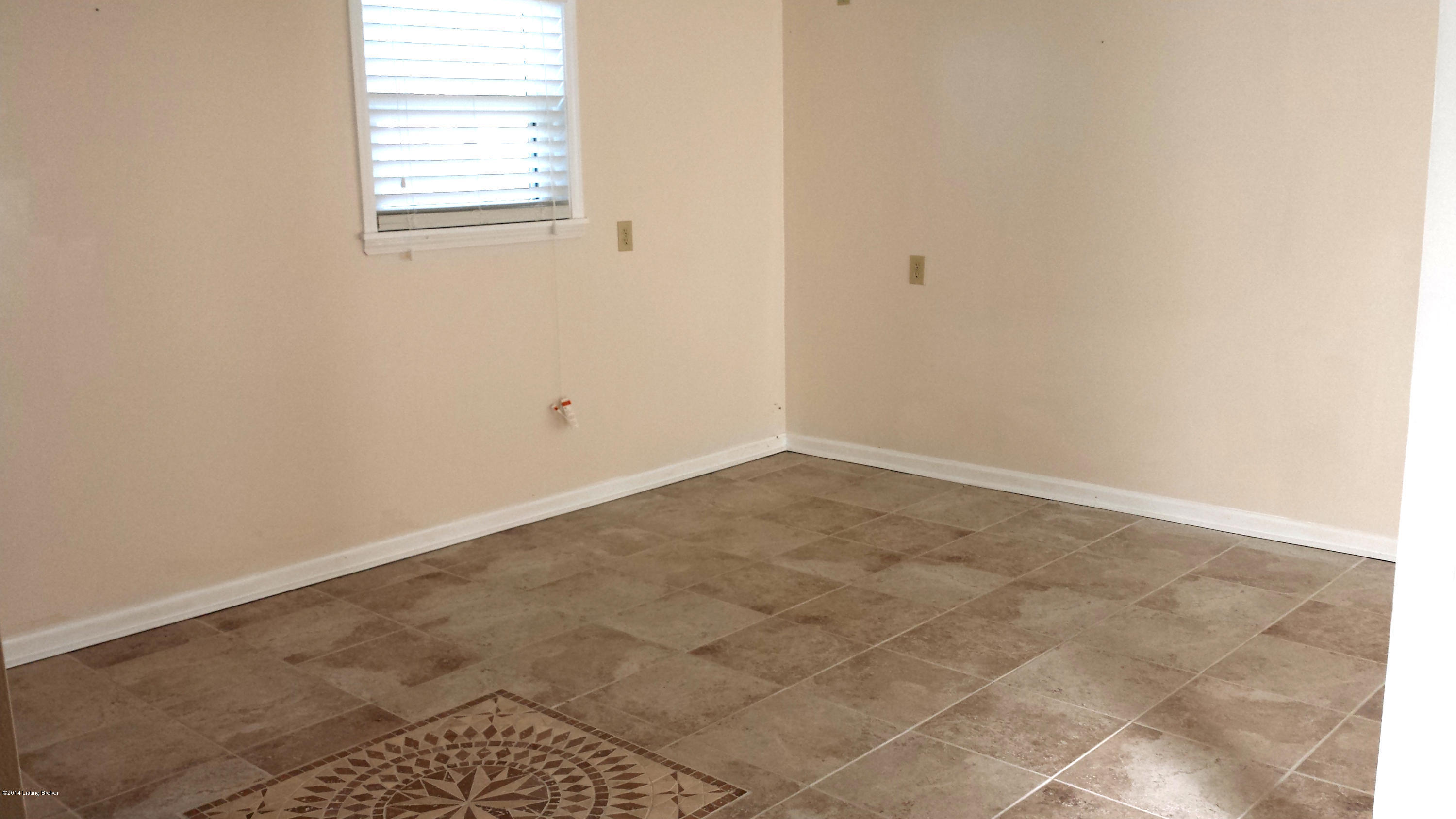 12216 Ridgemont Road Louisville, KY 40229 - Photo 21 of 35 Finished lower level family room