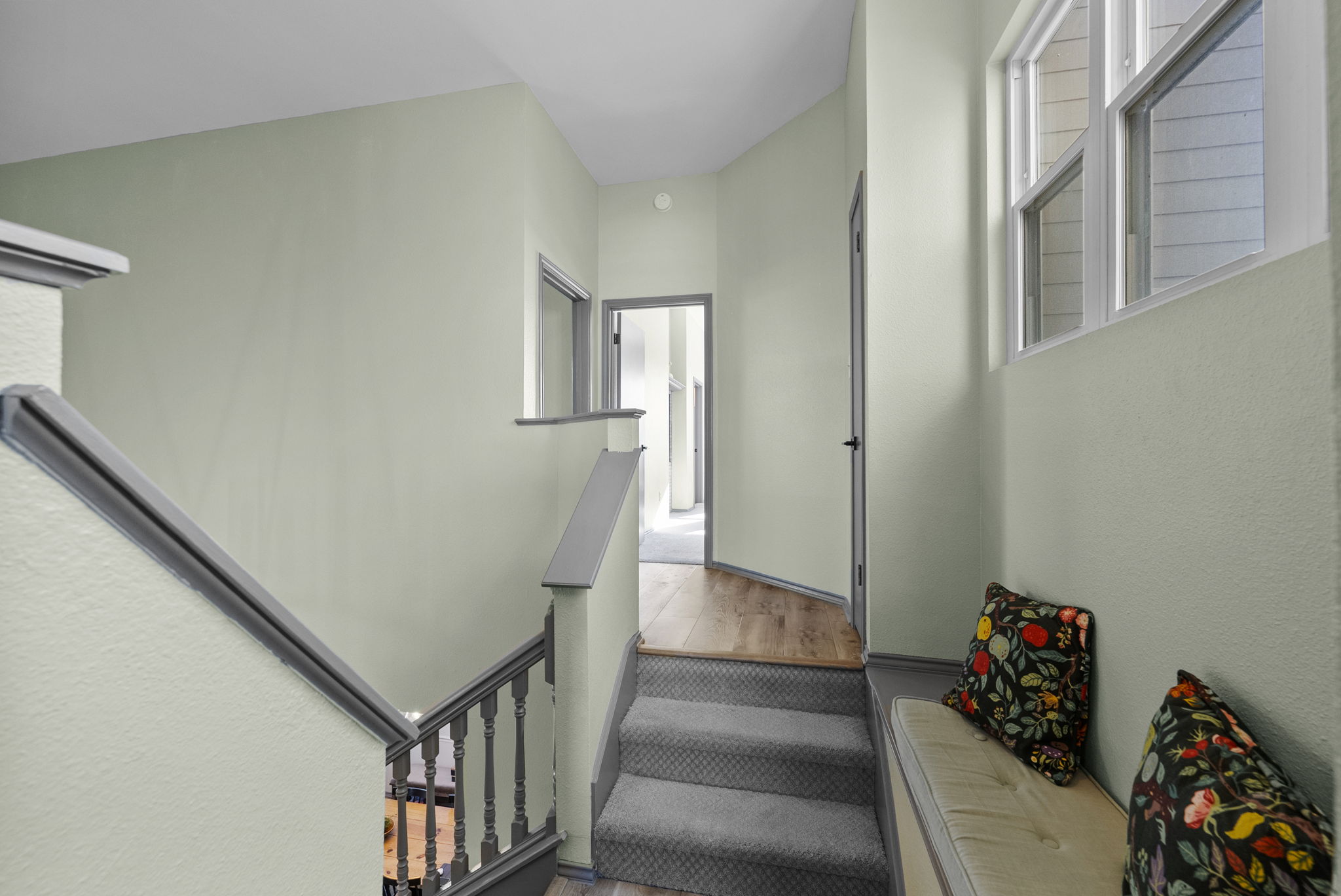 8102 Flashpan Cove Austin, TX 78729 - Photo 13 of 36 All bedrooms are located upstairs. The stairs split and go right to the primary + another bedroom and left to 2 bedrooms + bathroom.