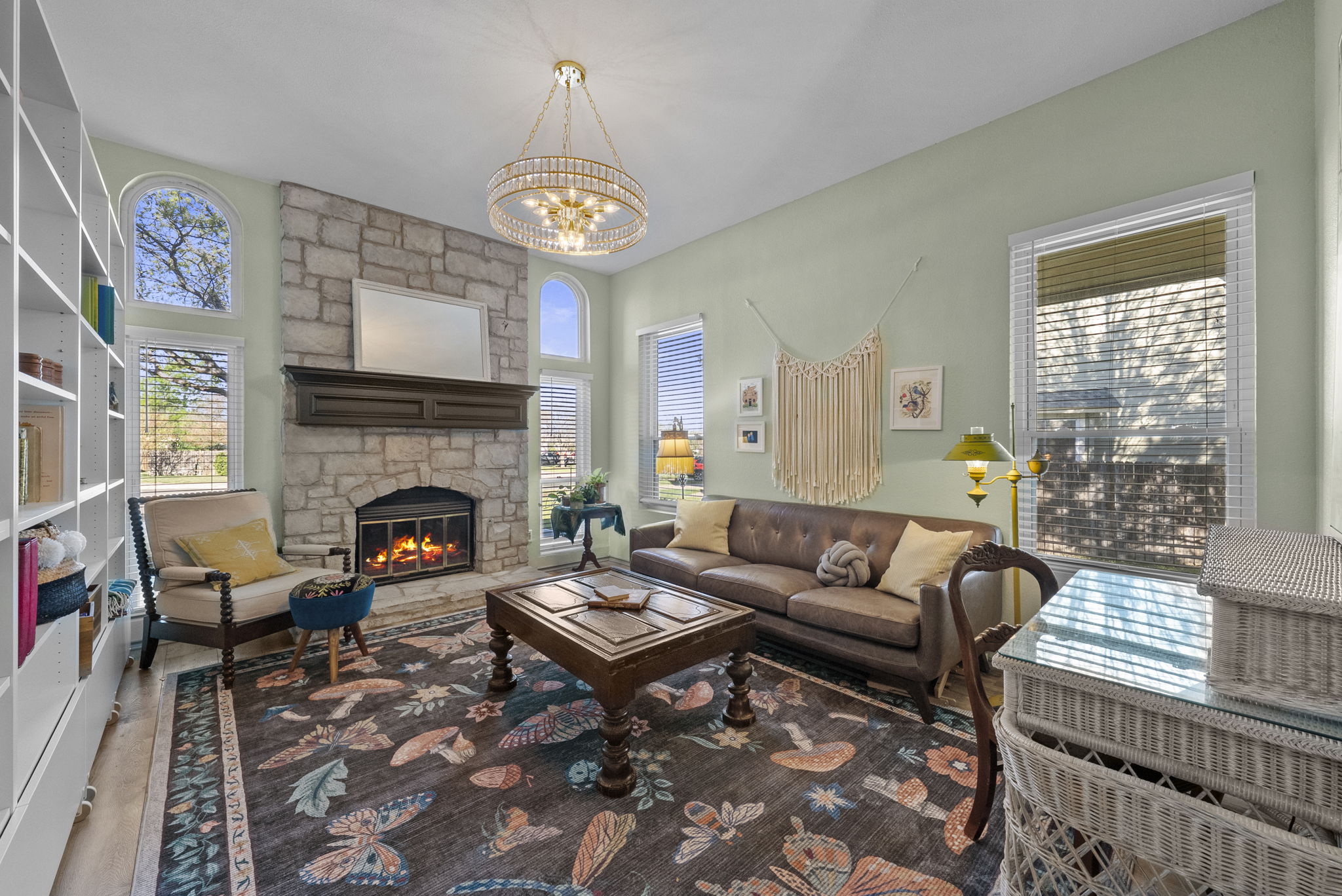 8102 Flashpan Cove Austin, TX 78729 - Photo 3 of 36 Formal living room with a fireplace to the right of the entry.