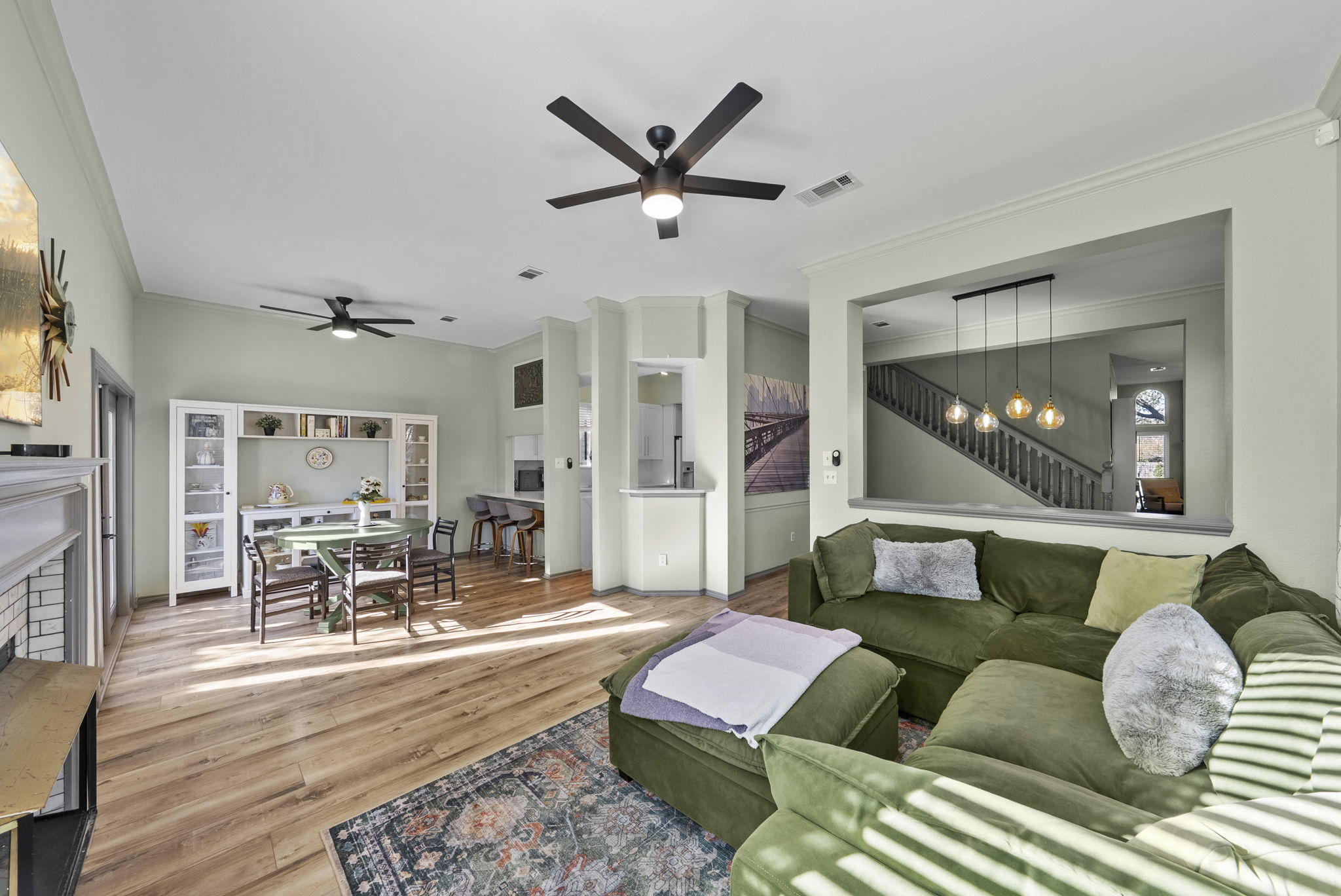 8102 Flashpan Cove Austin, TX 78729 - Photo 7 of 36 Living room towards the back of the home near the breakfast area.
