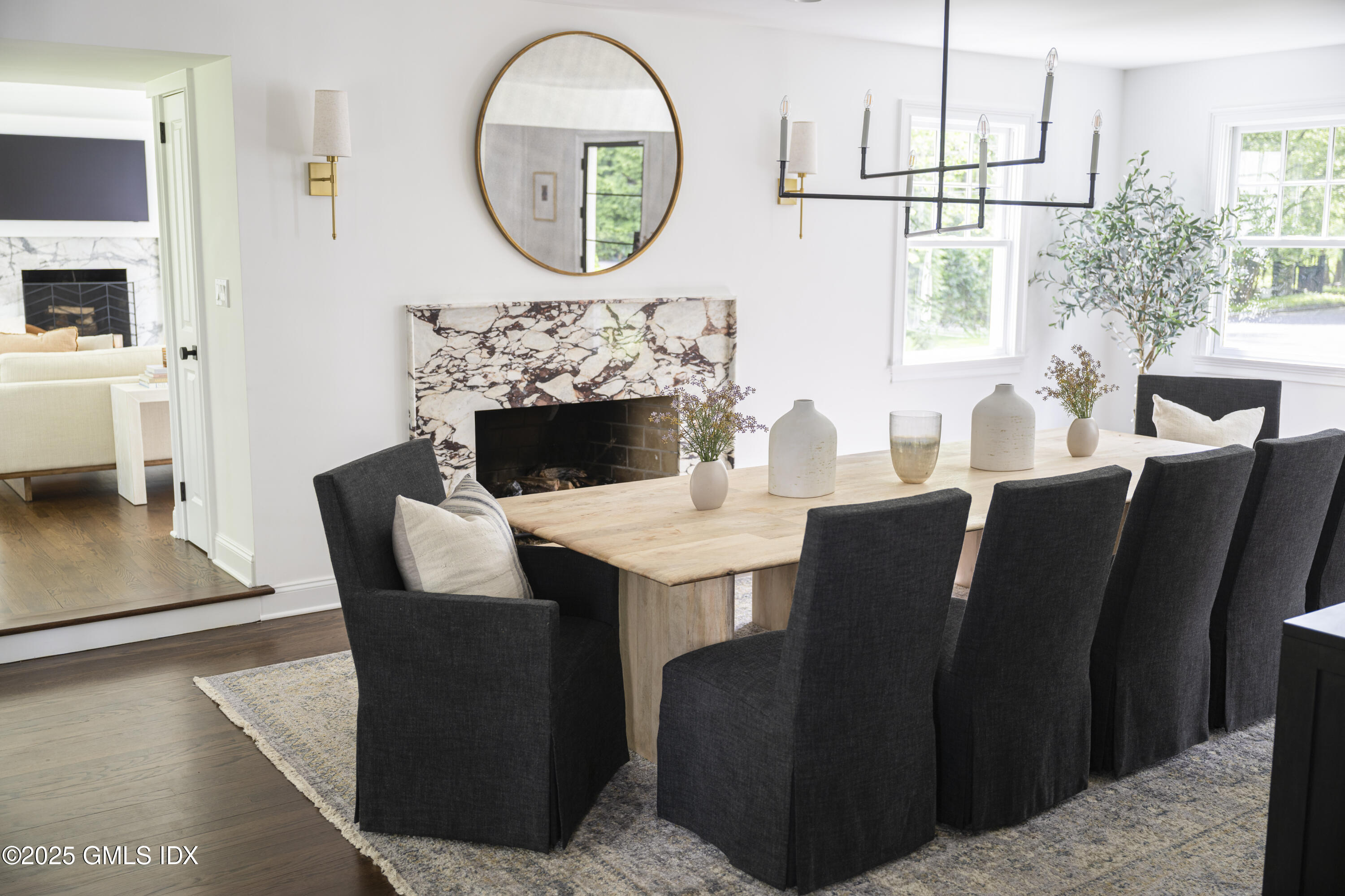 95 Indian Head Road Riverside, CT 06878 - Photo 6 of 10 a living room with furniture a window and a fireplace