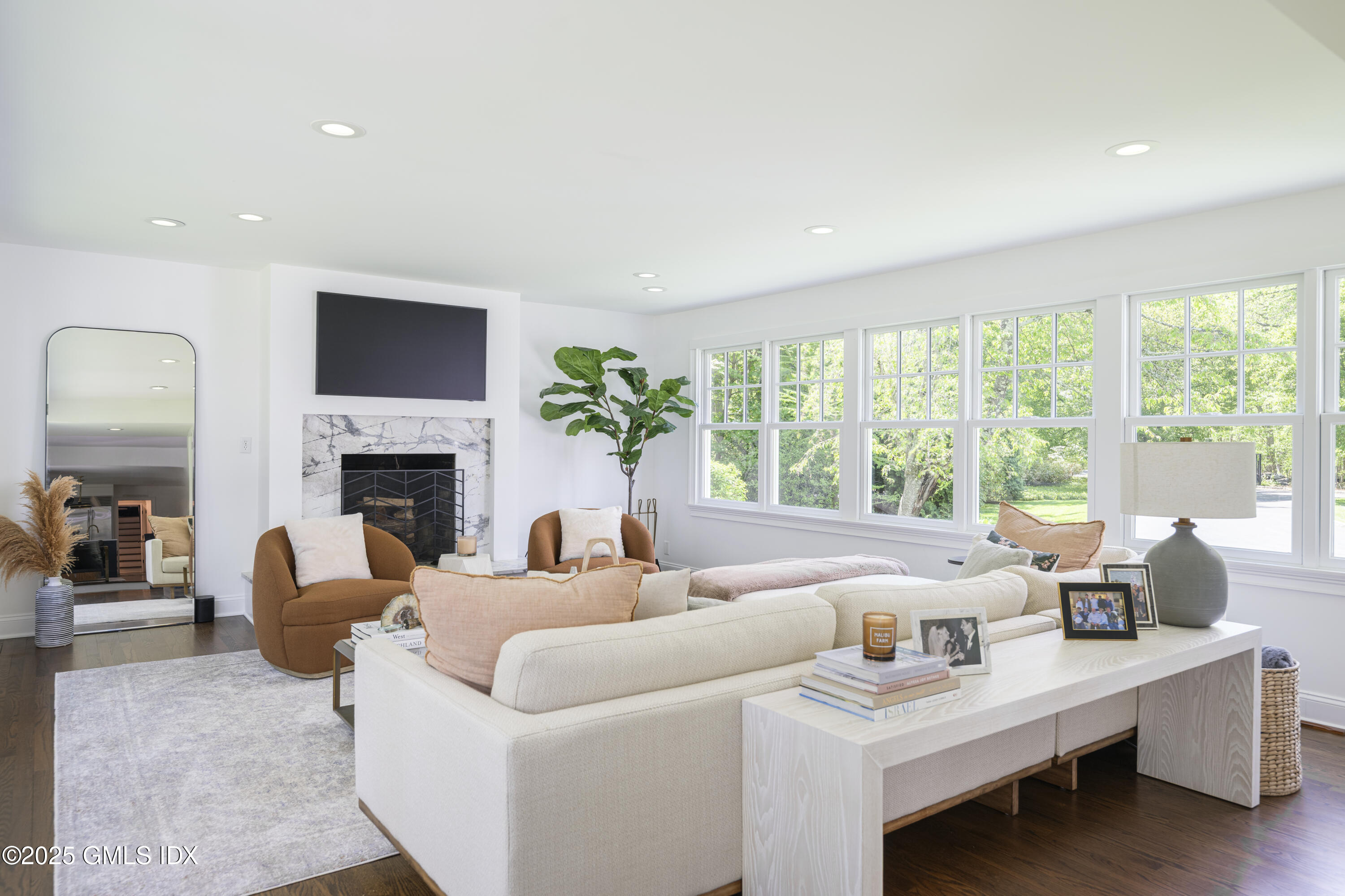 95 Indian Head Road Riverside, CT 06878 - Photo 7 of 10 a living room with furniture and a fireplace