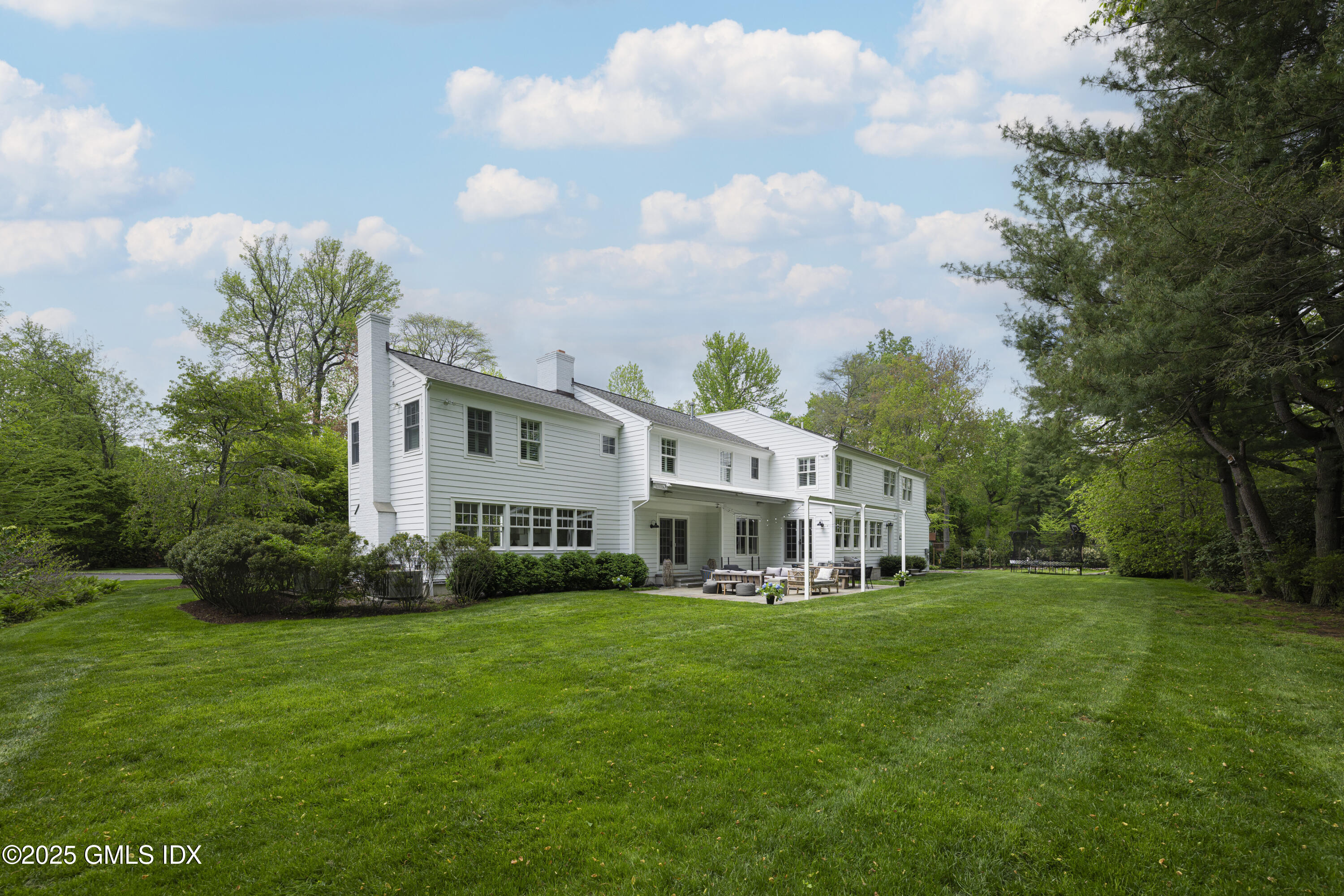 95 Indian Head Road Riverside, CT 06878 - Photo 9 of 10 a view of a house with a big yard and large trees
