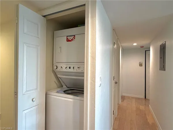 a view of a hallway with washer and dryer