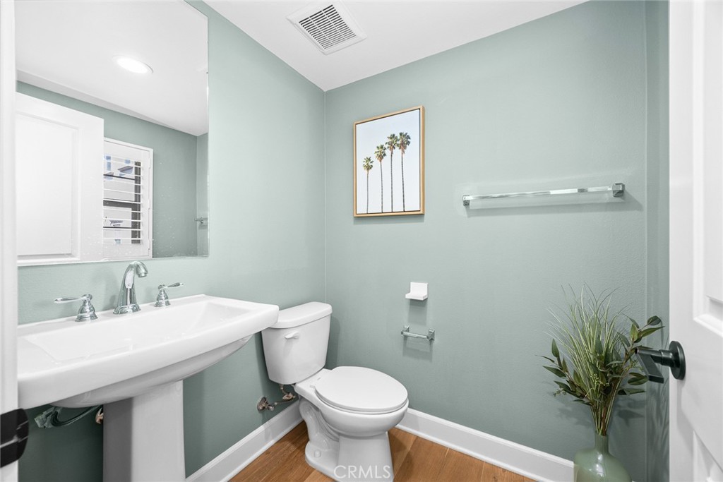 843 Orchid Way, Unit D Azusa, CA 91702 - Photo 17 of 38 a bathroom with a sink mirror and toilet