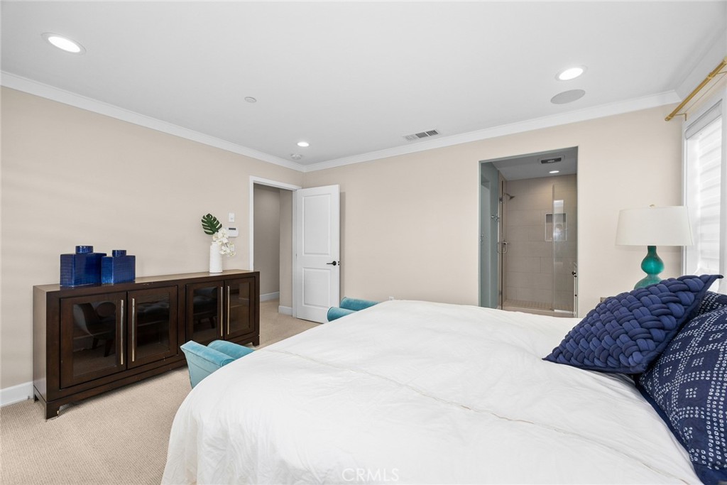 843 Orchid Way, Unit D Azusa, CA 91702 - Photo 19 of 38 a spacious bedroom with a bed and a dresser