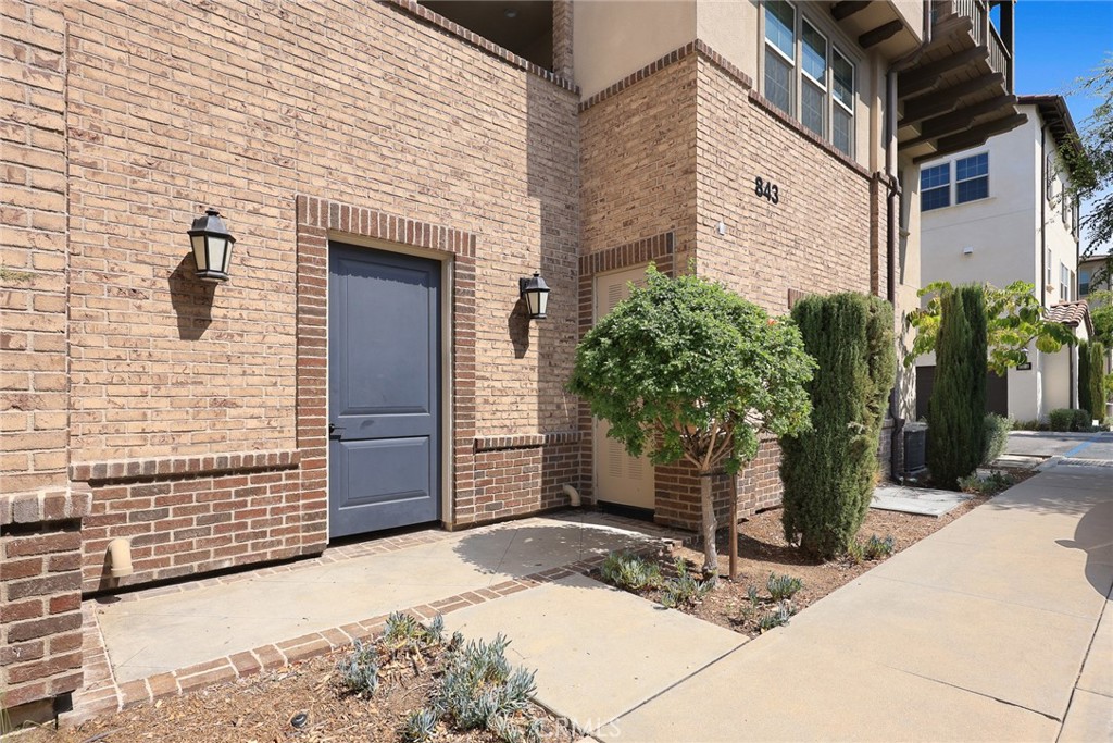 843 Orchid Way, Unit D Azusa, CA 91702 - Photo 3 of 38 a couple of potted plants in front of door