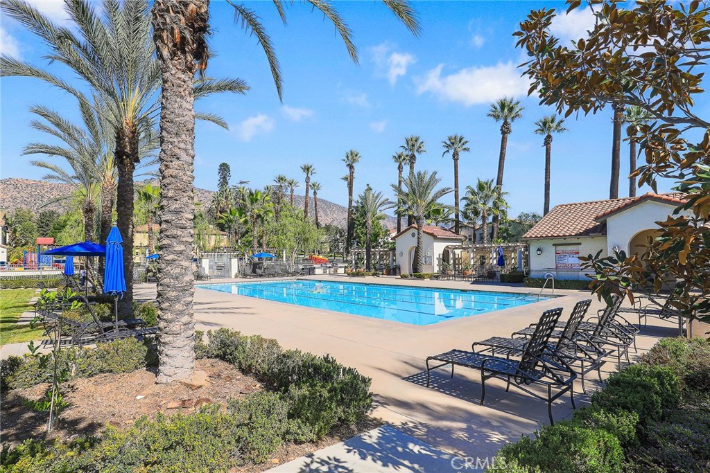 843 Orchid Way, Unit D Azusa, CA 91702 - Photo 31 of 38 a view of a swimming pool with a patio
