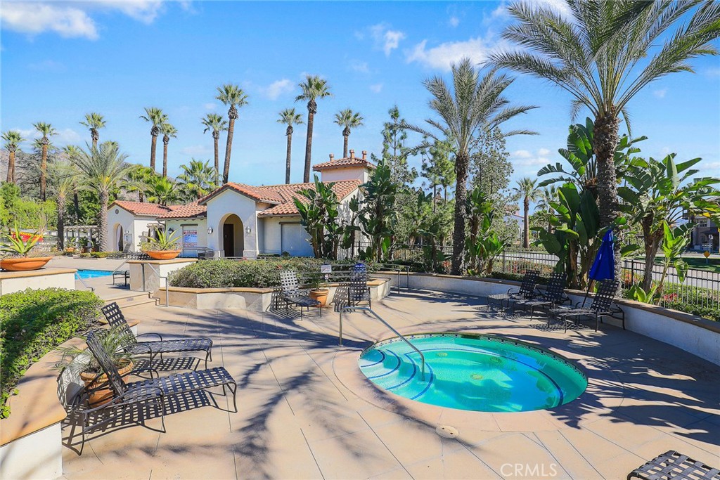 843 Orchid Way, Unit D Azusa, CA 91702 - Photo 33 of 38 a house with palm tree in the background