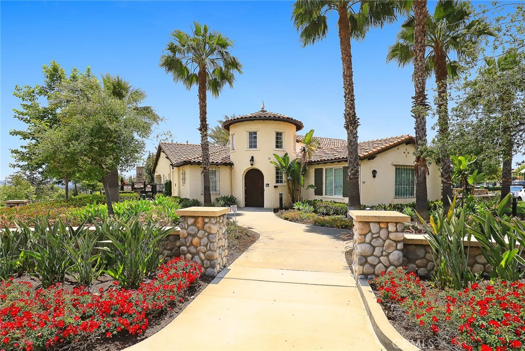 843 Orchid Way, Unit D Azusa, CA 91702 - Photo 36 of 38 a front view of a house with a yard and fountain
