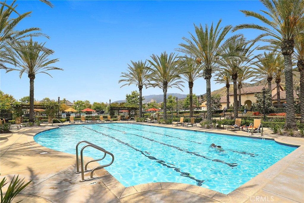 843 Orchid Way, Unit D Azusa, CA 91702 - Photo 38 of 38 a view of a swimming pool with a table and chairs
