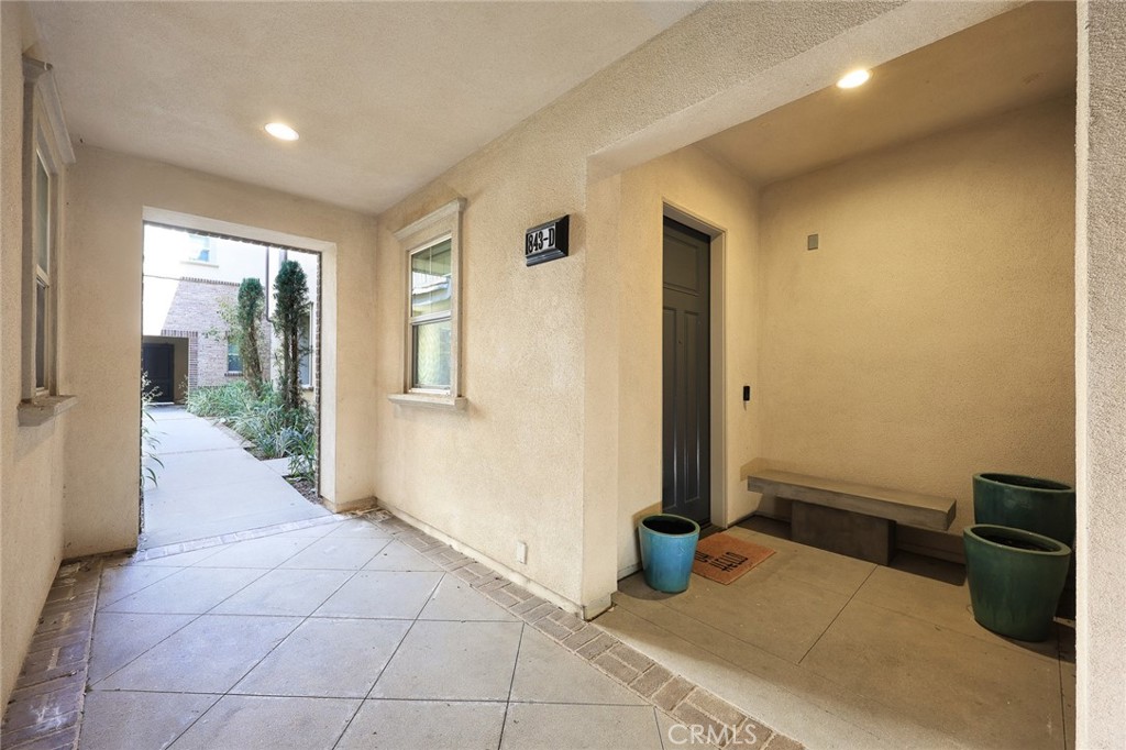 843 Orchid Way, Unit D Azusa, CA 91702 - Photo 4 of 38 a view of a hallway with bathroom and glass door
