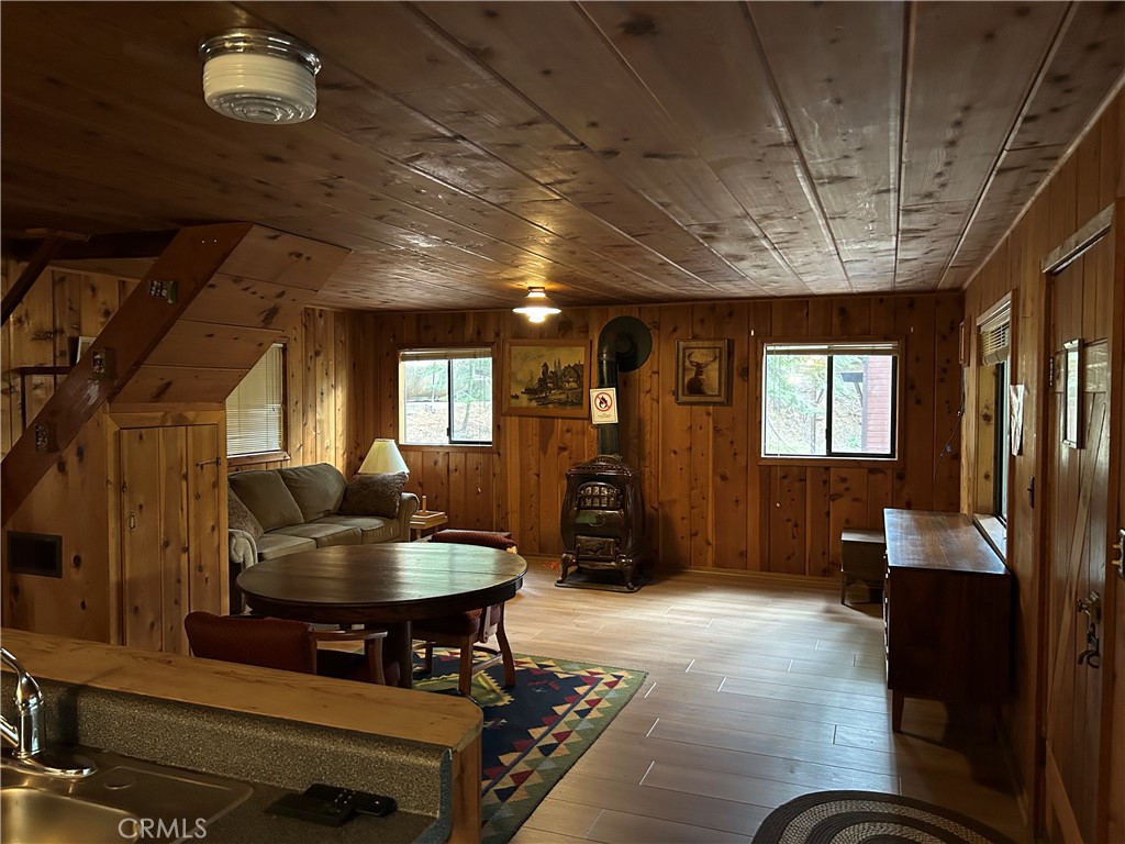 7771 White Chief Mountain Road Fish Camp, CA 93623 - Photo 2 of 4 a living room with furniture and a wooden floor