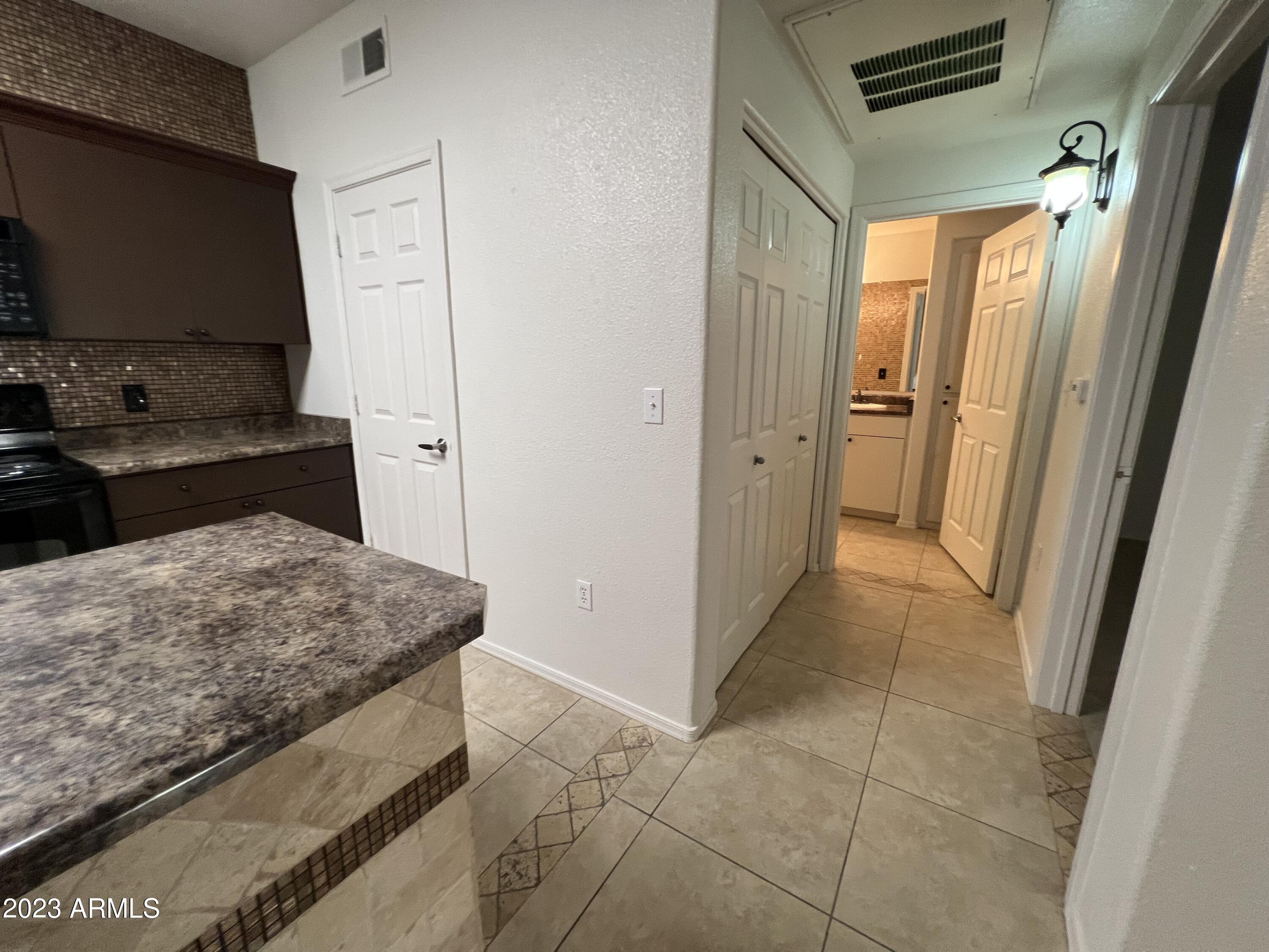18416 North Cave Creek Road, Unit 1059 Phoenix, AZ 85032 - Photo 31 of 45 Hallway to Bedroom & Bath