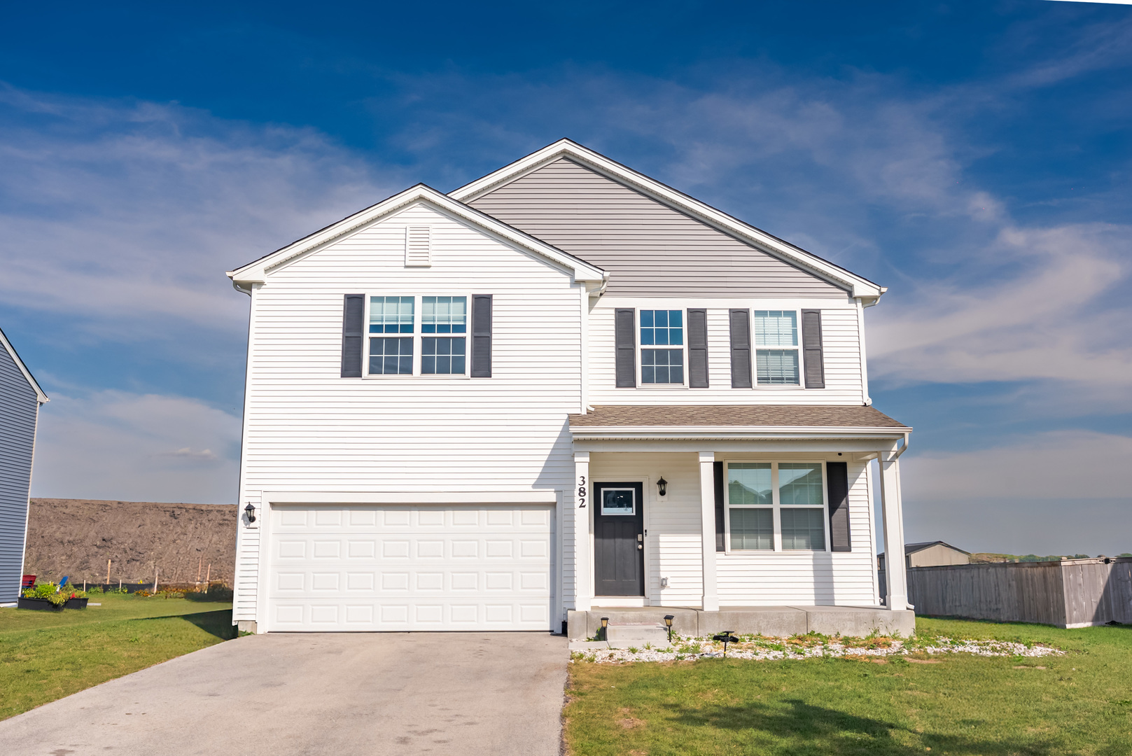 382 Hemlock Lane Oswego, IL 60543 - Photo 1 of 17 a front view of a house with a yard