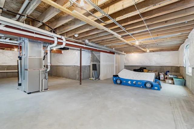 a view of empty room with wooden ceiling