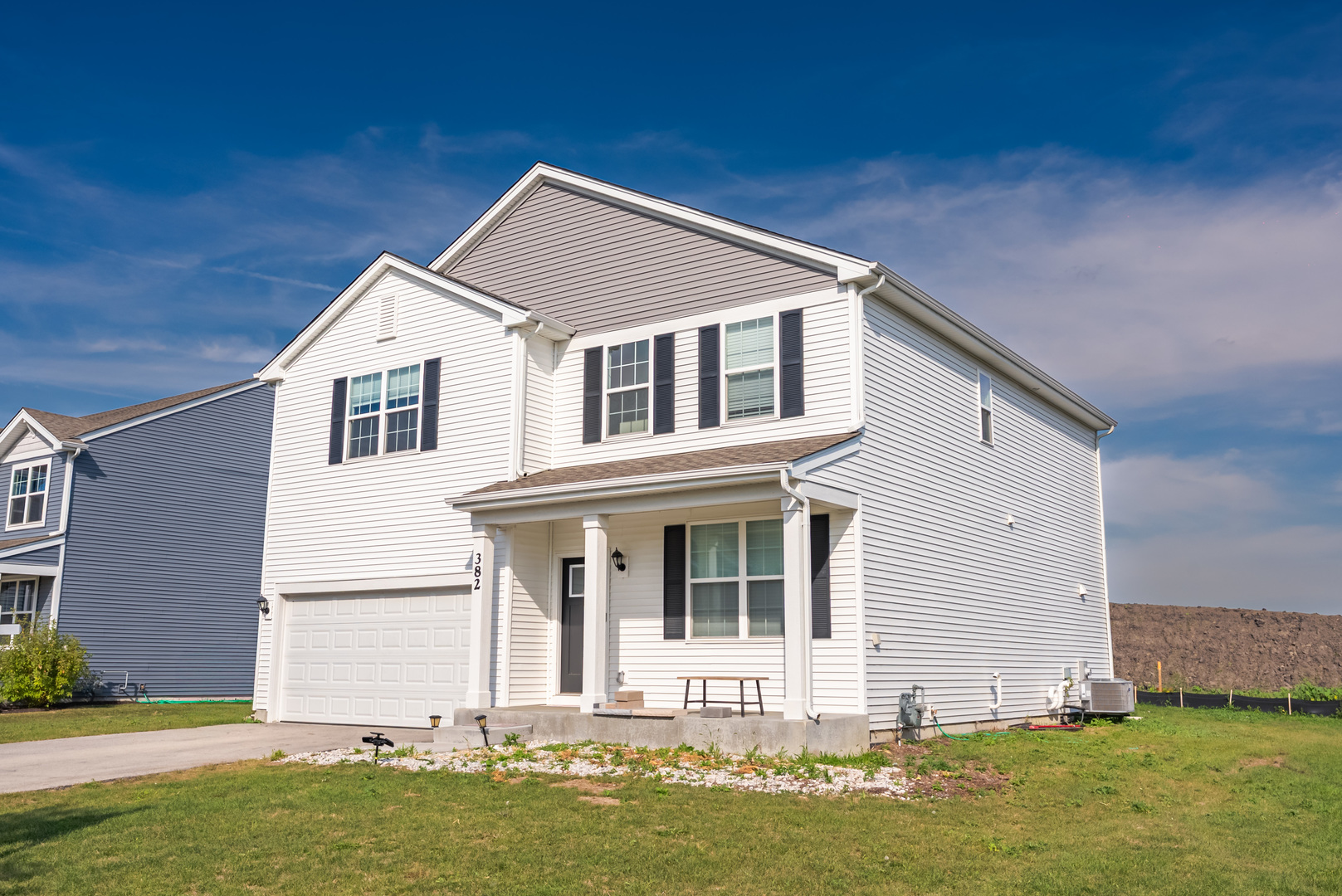 382 Hemlock Lane Oswego, IL 60543 - Photo 2 of 17 a front view of a house with a yard