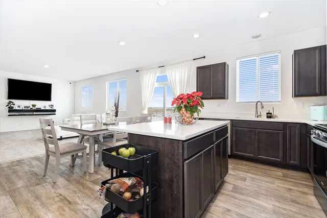 a kitchen with a sink cabinets and window