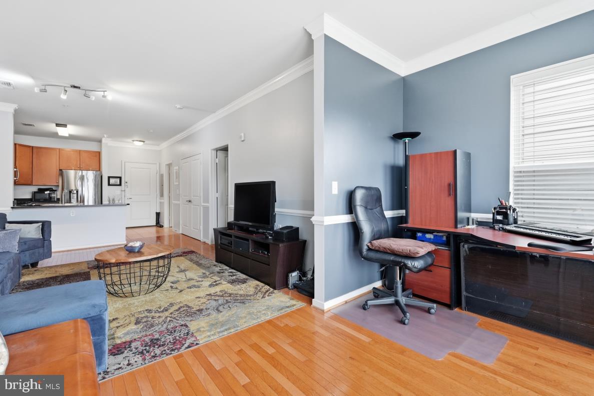 8045 Newell Street, Unit 423 Silver Spring, MD 20910 - Photo 8 of 26 a bedroom with a workspace