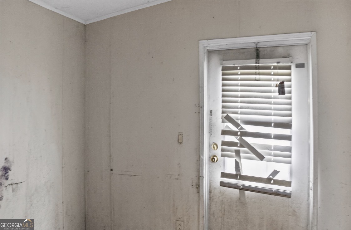 4402 Harper Road Metter, GA 30439 - Photo 18 of 19 a view of a room with rack on the wall