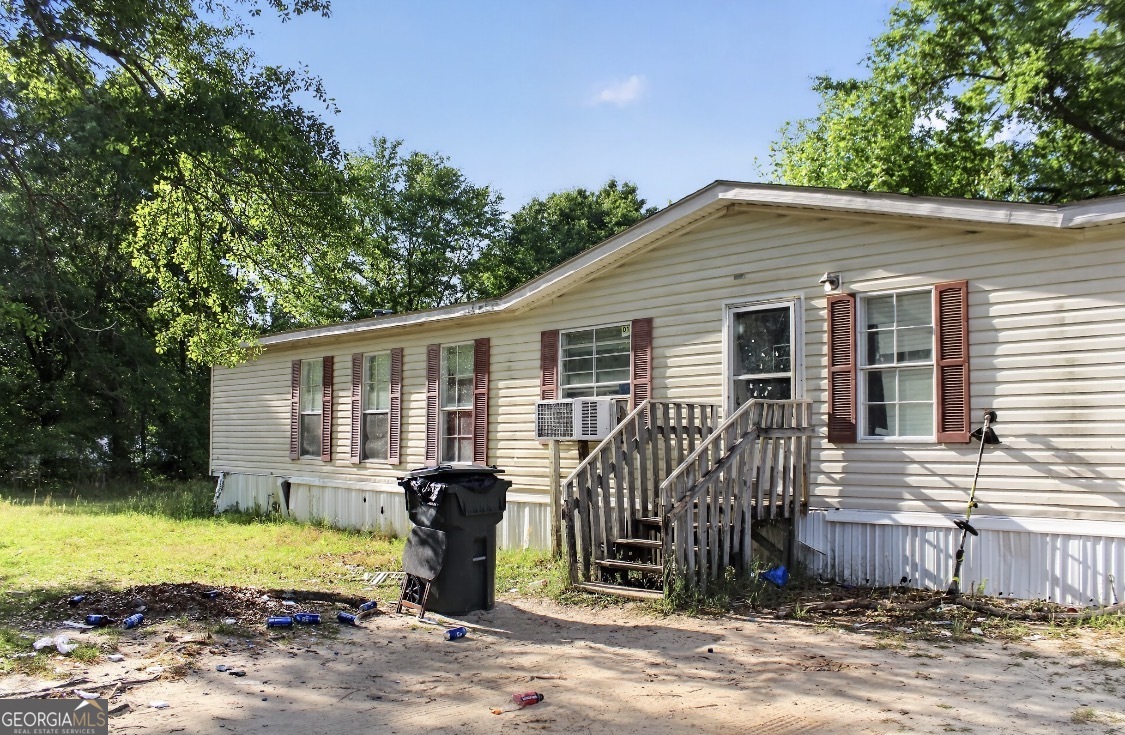 4402 Harper Road Metter, GA 30439 - Photo 3 of 19 a view of a house with a yard