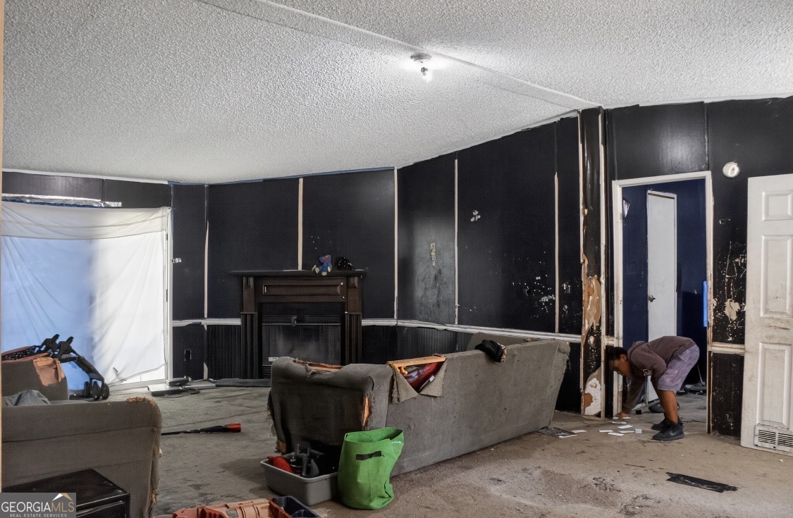 4402 Harper Road Metter, GA 30439 - Photo 7 of 19 a living room with furniture and a flat screen tv
