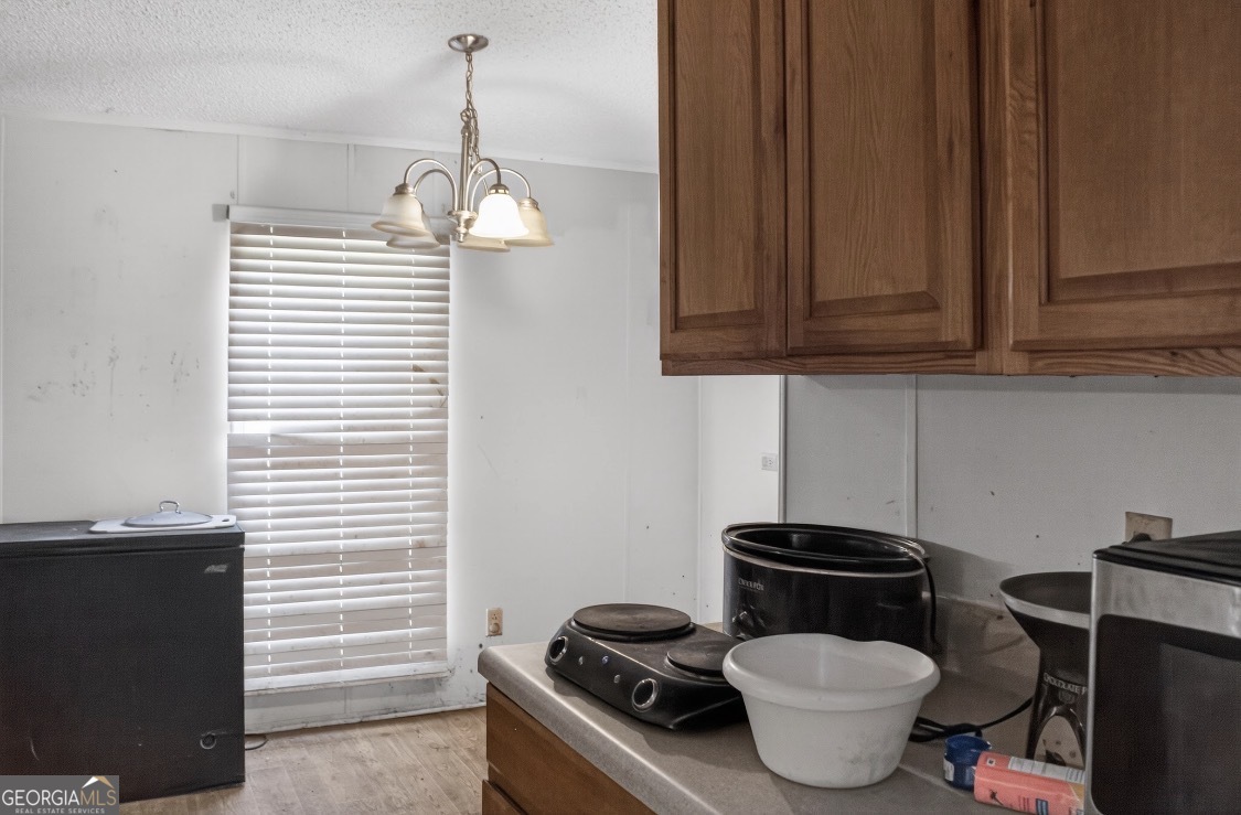 4402 Harper Road Metter, GA 30439 - Photo 10 of 19 a stove top oven sitting inside of a kitchen