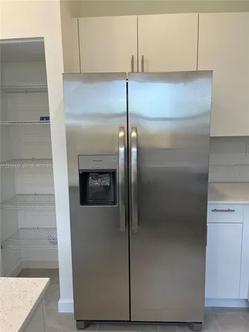 a stove top oven sitting inside of a kitchen