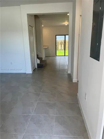 a view of an empty room with a bathroom